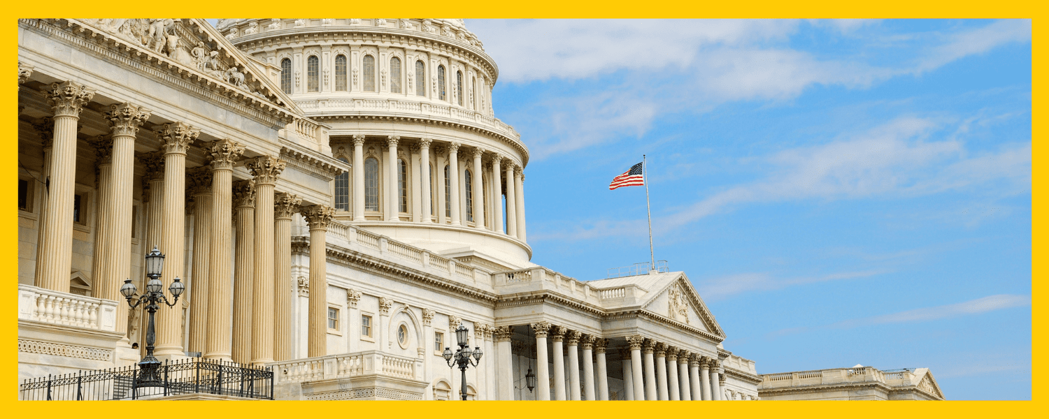 the US capitol flying the US flag