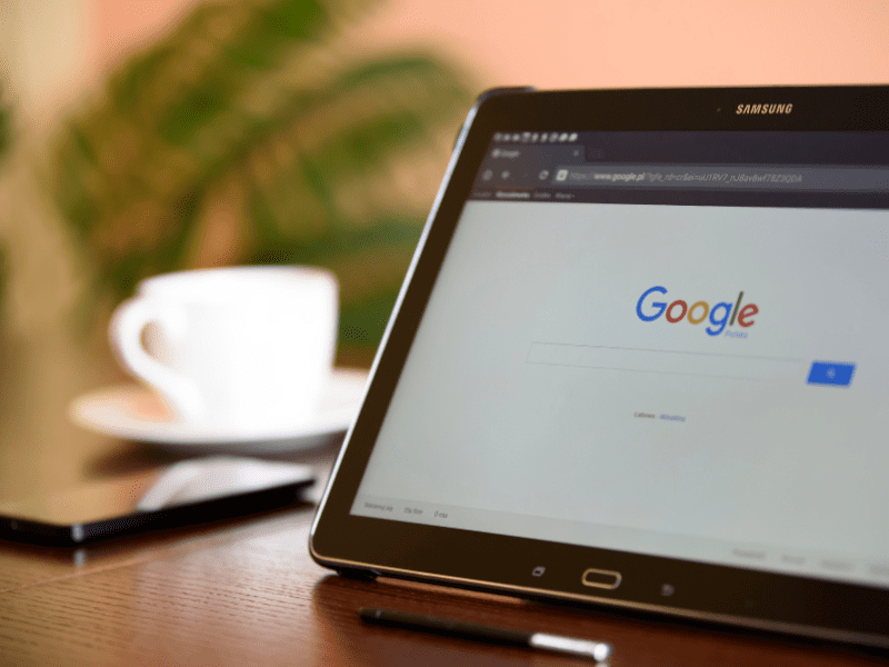 Laptop computer with the screen open to a Google chat window where team members are communicating.