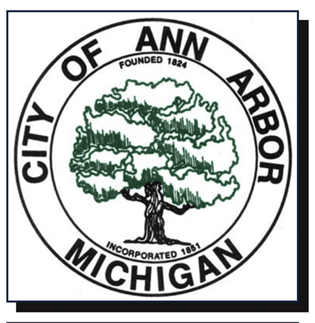 City seal for Ann Arbor, Michigan, showing a green tree in the center with black text encircling the seal that reads 'City of Ann Arbor Michigan.' Additional small text says 'Founded 1824' and 'Incorporated 1851.'