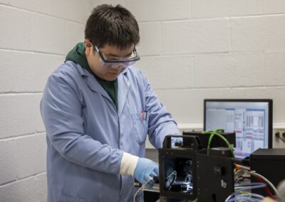 Zhenyu Ma, research fellow in civil and environmental engineering, prepares a machine that suspends aerosol droplets for research.