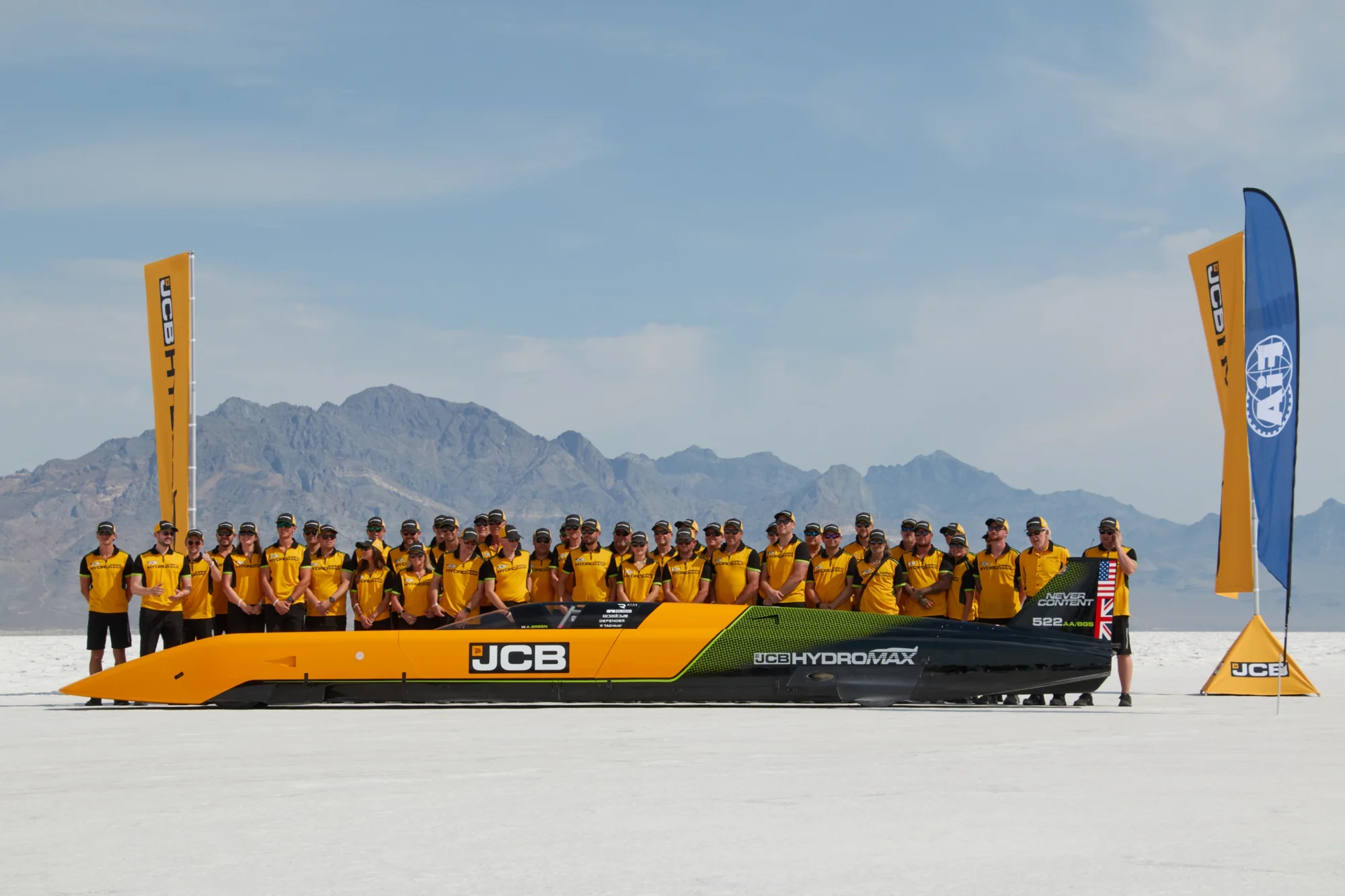 A group poses in front of a screen that reads MI Hydrogen Geologic Workshop